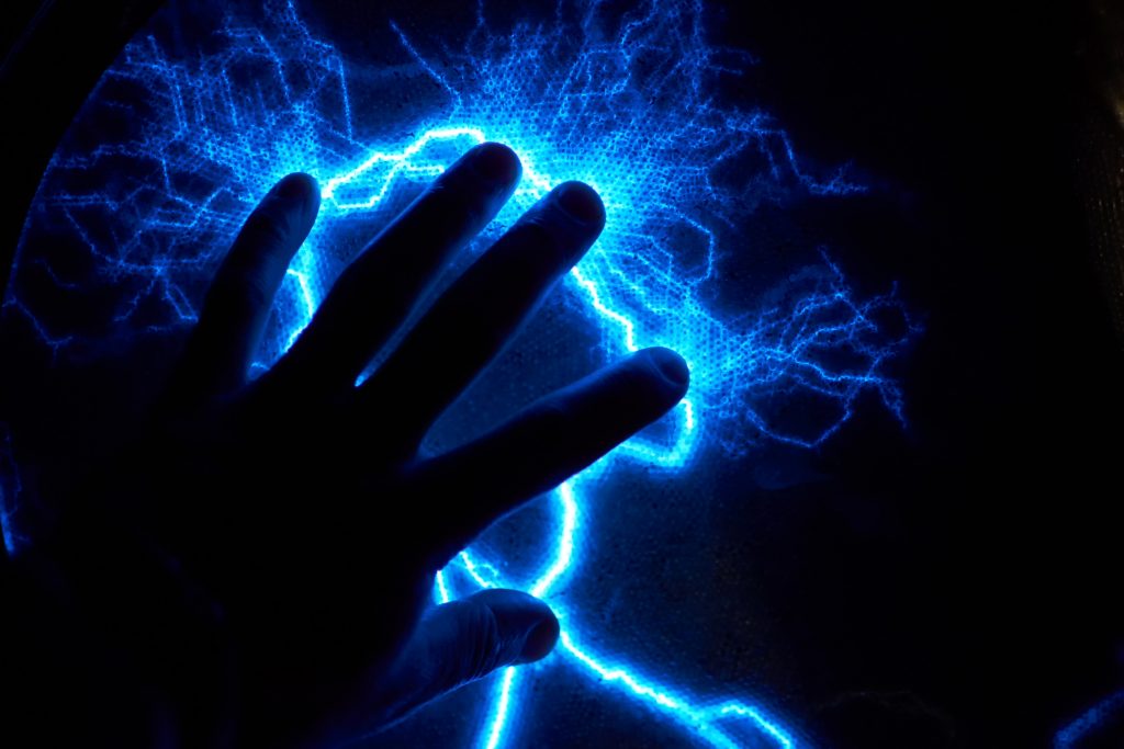 human hand static electricity also known as electrostatic discharge blue and black looks like lightning